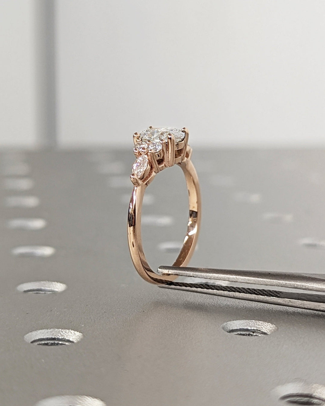 Sparkling oval diamond cluster ring with delicate details
