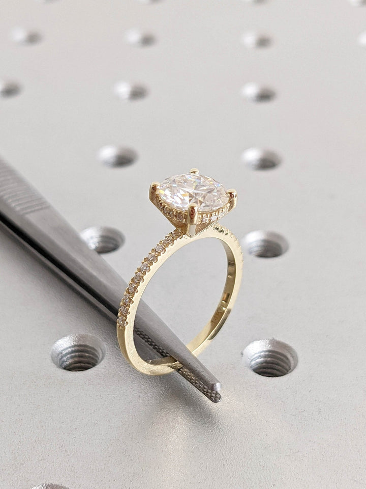 Elegant proposal ring with hidden halo and pave setting
