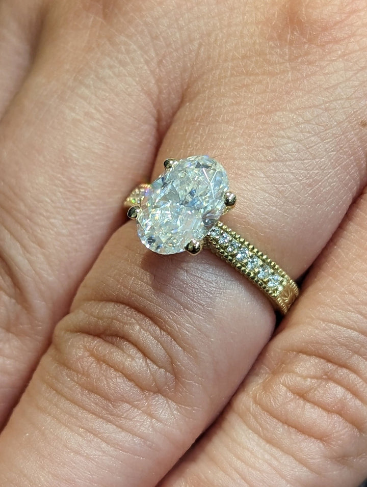 Modern vintage engagement ring featuring oval lab diamond