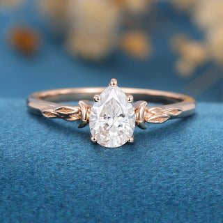 0-69-ct-pear-shaped-moissanite-vintage-solitaire-engagement-ring-1