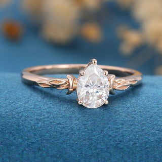 0-69-ct-pear-shaped-moissanite-vintage-solitaire-engagement-ring-3