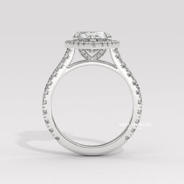 Elongated radiant cut ring
Modern engagement ring
Classic halo ring
Diamond halo setting