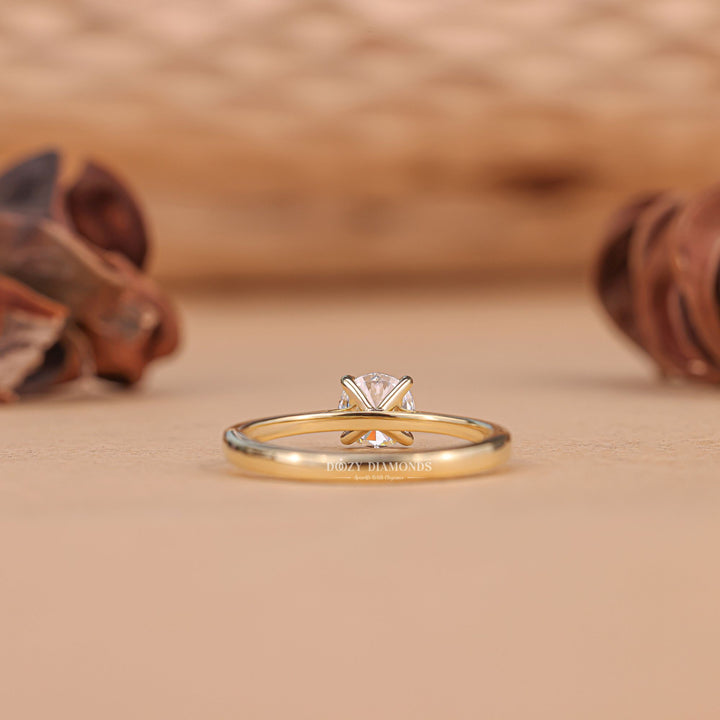 sophisticated diamond ring, luxury fashion jewelry, bridal solitaire jewelry, polished diamond ring, elegant proposal jewelry, contemporary engagement ring, round center stone ring,