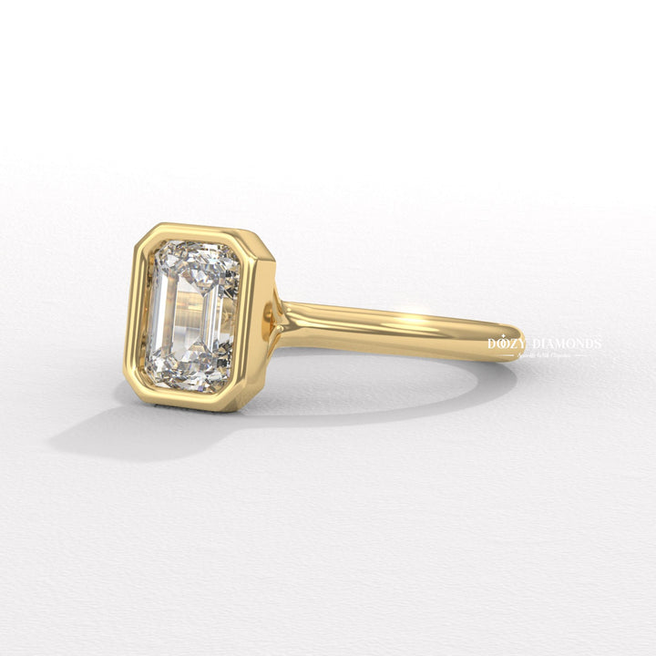 emerald ring, luxury emerald diamond ring, IGI diamond certificate, bezel bridal ring, emerald proposal ring, contemporary diamond ring, secure setting engagement ring, elegant emerald