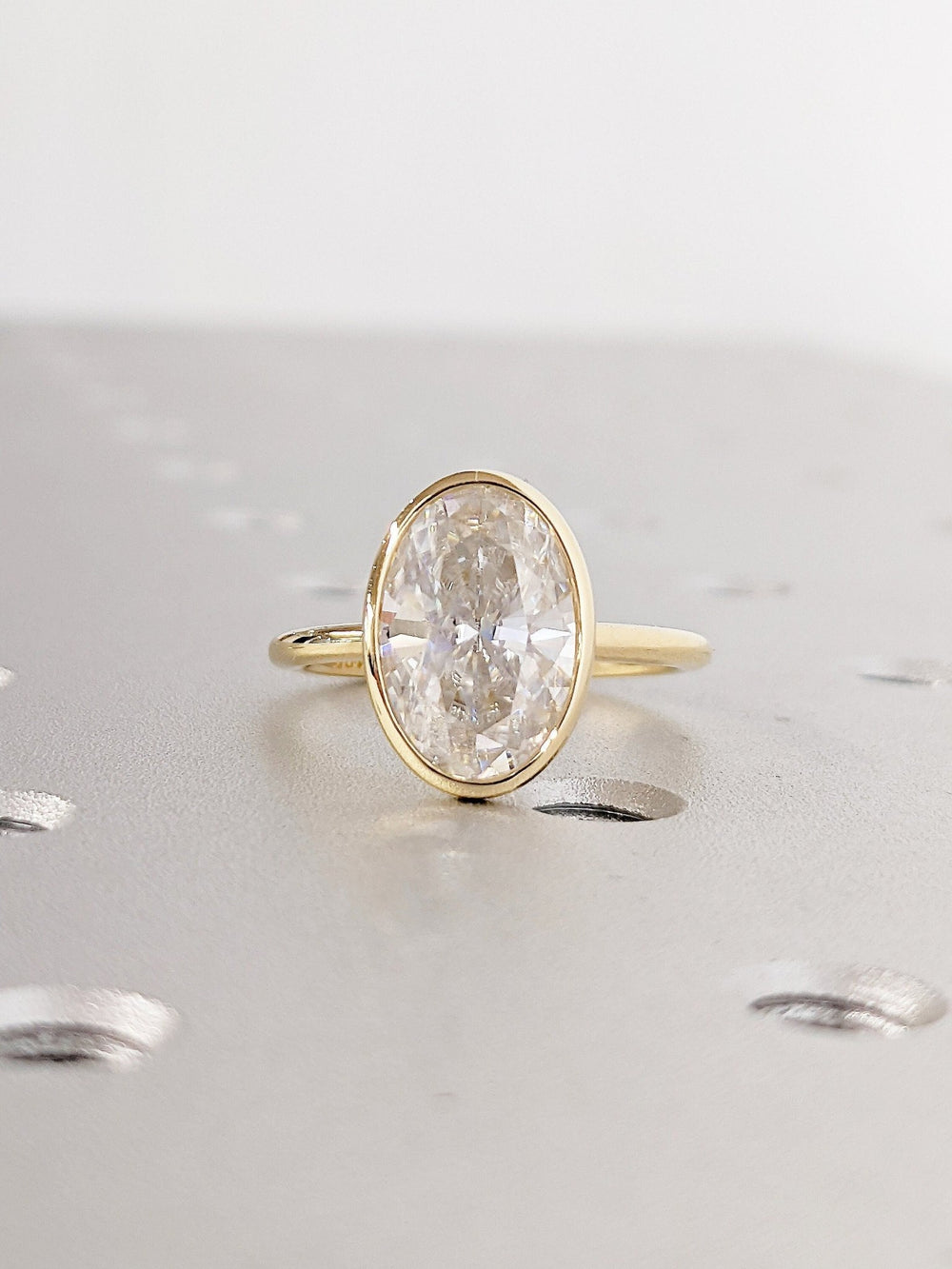 Women's 3 carat oval cut bezel lab grown diamond ring