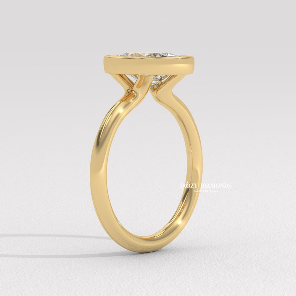 minimalist diamond ring, contemporary bridal ring, secure setting diamond ring, modern proposal ring, luxury oval jewelry, elegant bezel design, oval center diamond, premium engagement jewelry,