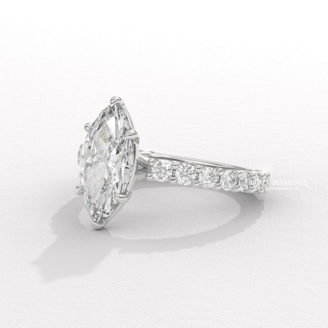 bridal fashion jewelry, artisan diamond ring, refined bridal jewelry, exclusive engagement ring, signature marquise ring, sparkling bridal jewelry, wedding celebration ring, commitment diamond ring