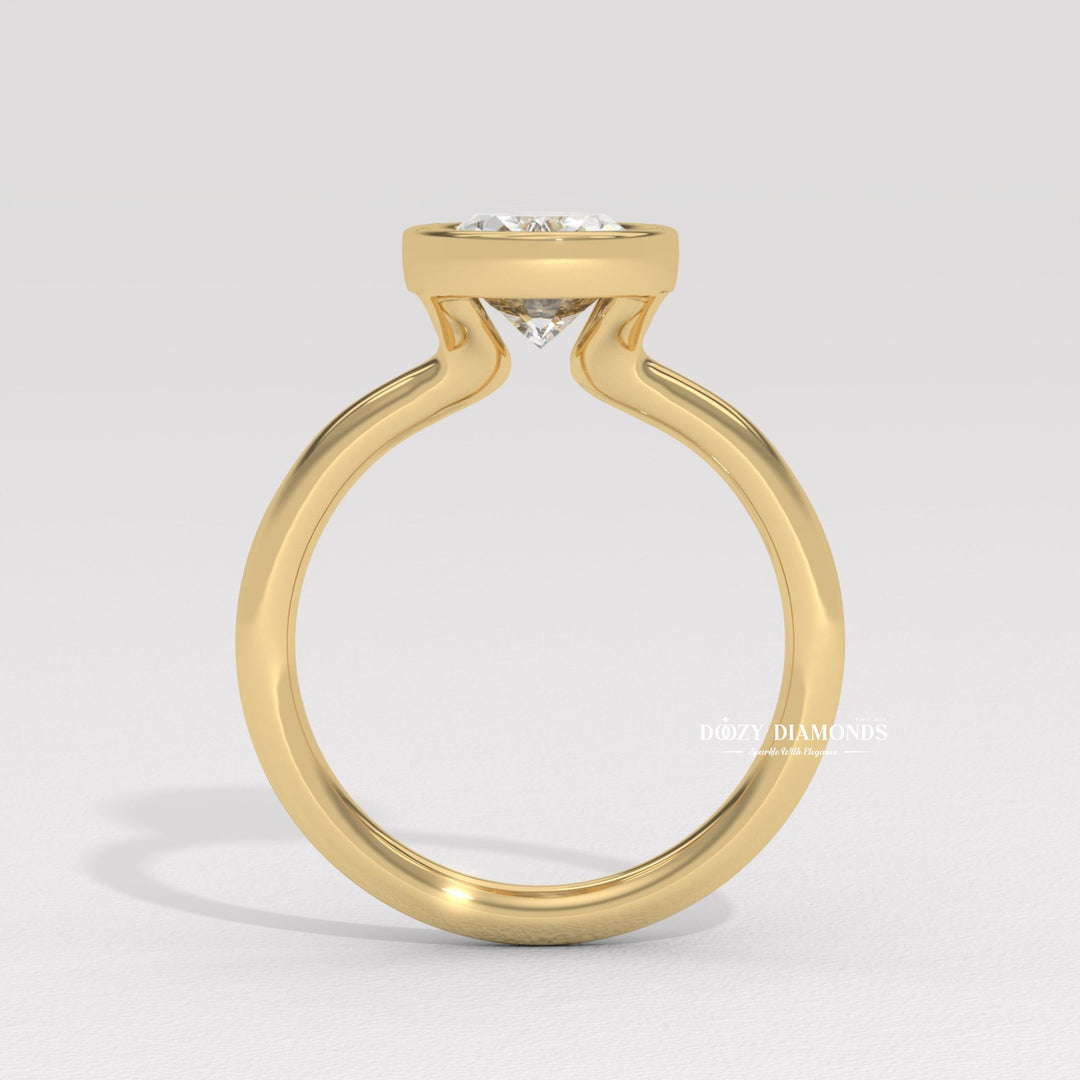 handcrafted diamond jewelry, sophisticated oval ring, timeless bezel setting, luxury proposal jewelry, fine diamond craftsmanship, artisan engagement ring, oval diamond proposal,