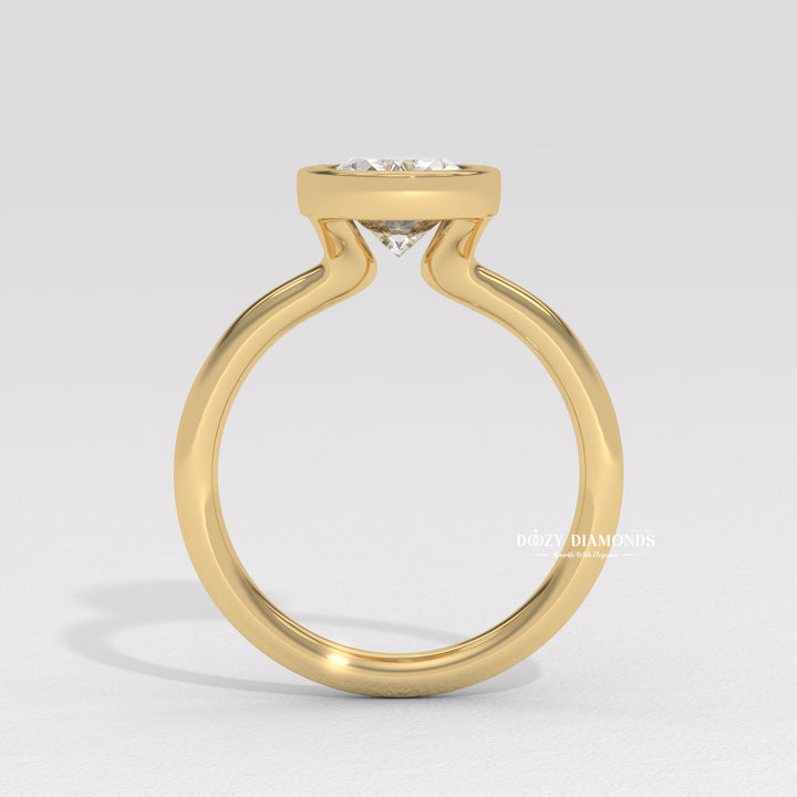 handcrafted diamond jewelry, sophisticated oval ring, timeless bezel setting, luxury proposal jewelry, fine diamond craftsmanship, artisan engagement ring, oval diamond proposal,
