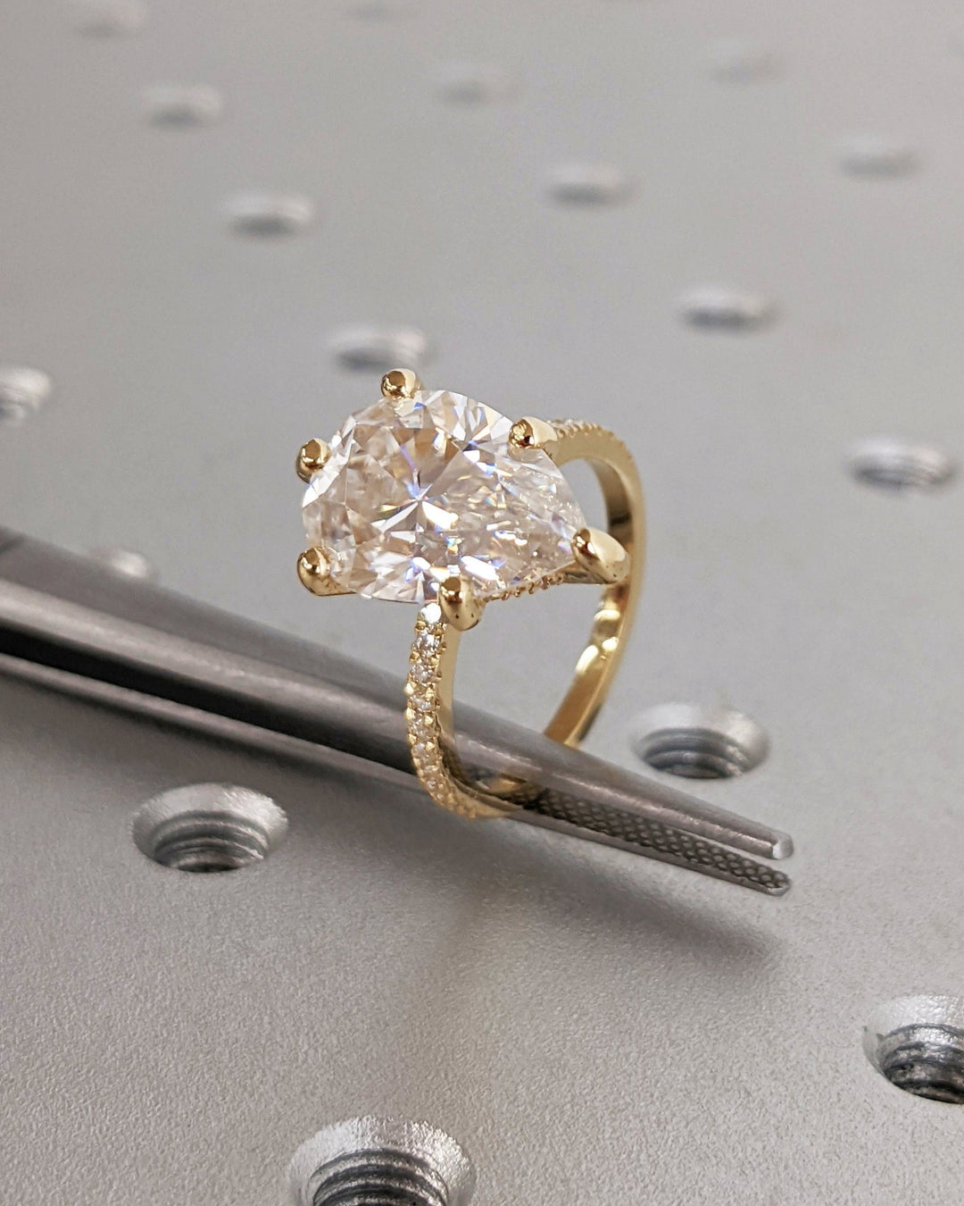 pear center stone hidden halo ring,