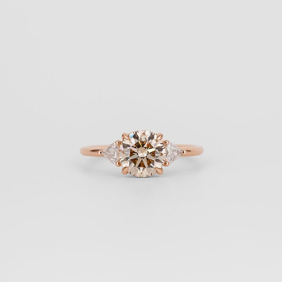 champagne diamond ring, champagne round diamond ring, champagne diamond engagement ring, round cut diamond ring, round brilliant diamond ring, three stone diamond ring, trilogy diamond ring, diamond engagement ring,
