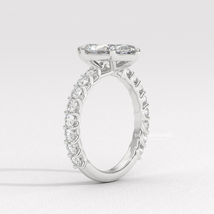 classic engagement ring, modern engagement ring, romantic proposal ring, marquise center stone ring, elongated bridal ring, luxury bridal jewelry, handcrafted engagement ring,