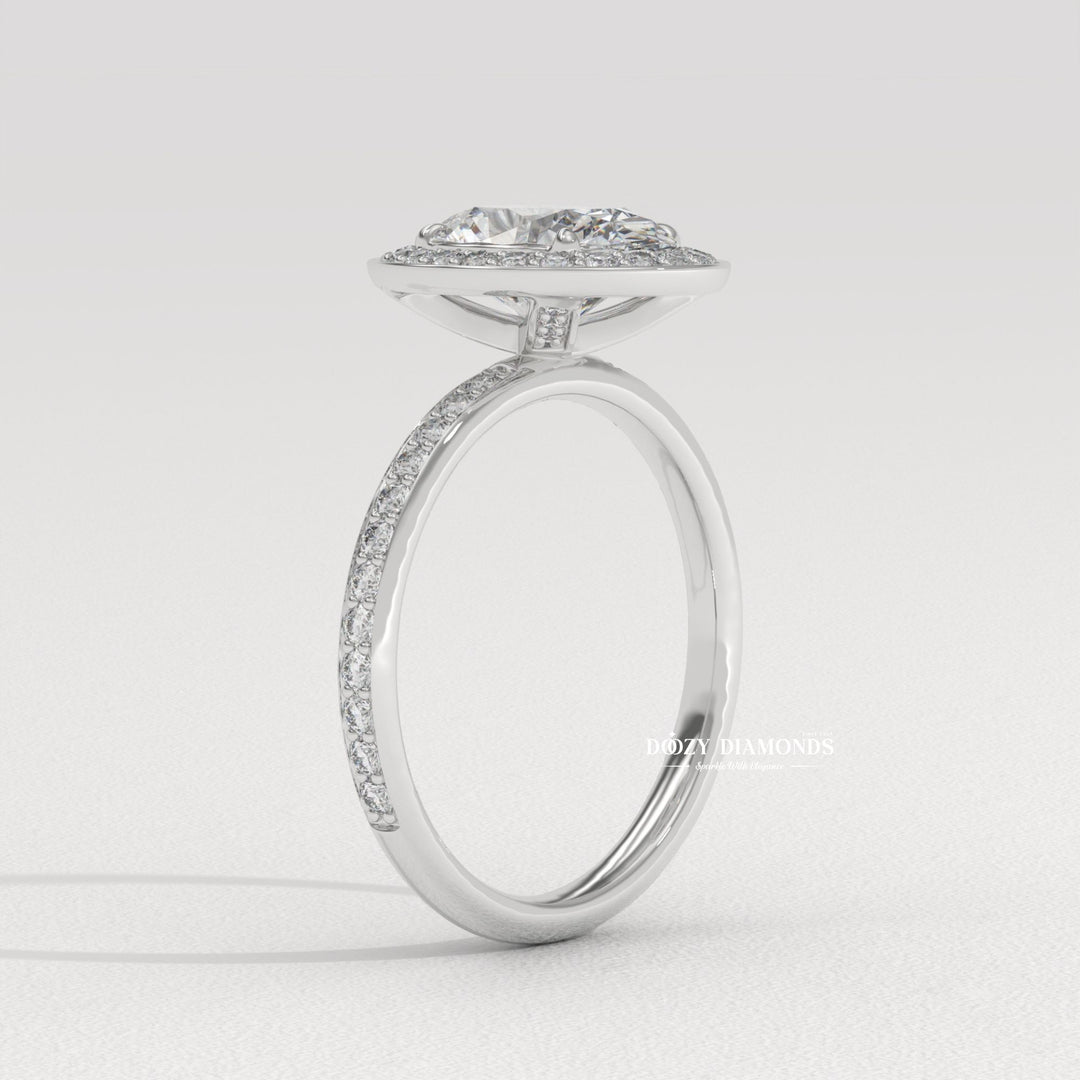 oval diamond bridal ring, channel set diamond ring, oval cut bridal jewelry, luxury halo diamond ring, diamond proposal ring, sustainable bridal ring, oval cut diamond ring, halo wedding ring