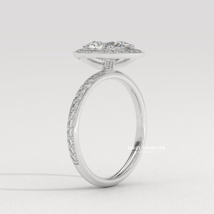 oval diamond bridal ring, channel set diamond ring, oval cut bridal jewelry, luxury halo diamond ring, diamond proposal ring, sustainable bridal ring, oval cut diamond ring, halo wedding ring