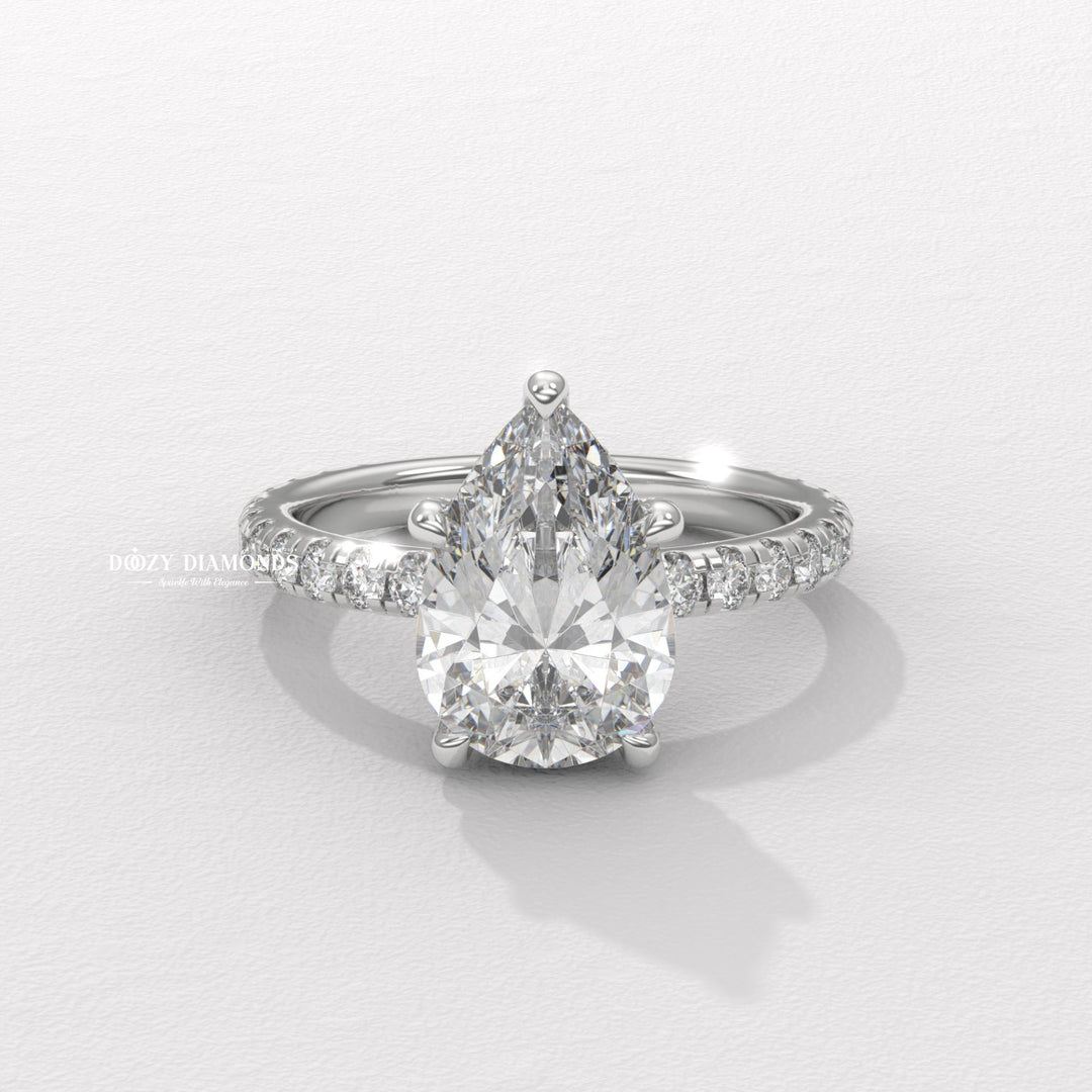 sparkling bridal ring, forever love ring, designer engagement ring, heirloom engagement ring, sophisticated diamond ring, luxury ring for women, wedding proposal ring, premium bridal jewelry, timeless bridal jewelry, elegant bridal jewelry, pear halo ring, pear pave ring