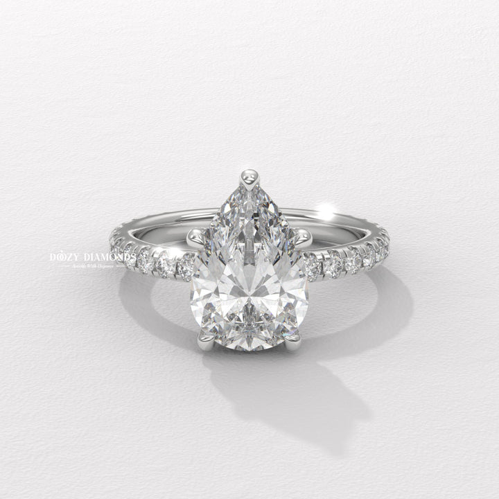 sparkling bridal ring, forever love ring, designer engagement ring, heirloom engagement ring, sophisticated diamond ring, luxury ring for women, wedding proposal ring, premium bridal jewelry, timeless bridal jewelry, elegant bridal jewelry, pear halo ring, pear pave ring