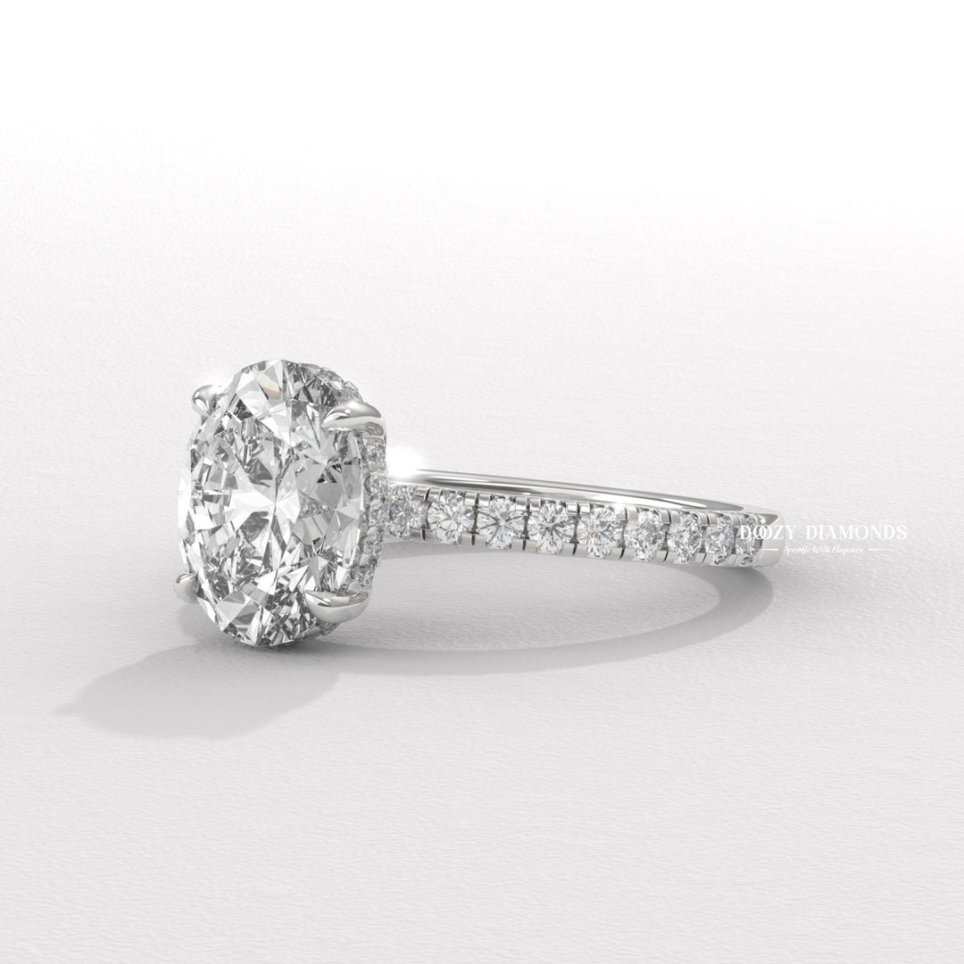 oval shape diamond ring, elongated diamond ring, engagement jewelry, bridal accessories, luxury bridal ring, handcrafted engagement ring, fine diamond jewelry, sparkling diamond ring,