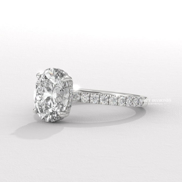 oval shape diamond ring, elongated diamond ring, engagement jewelry, bridal accessories, luxury bridal ring, handcrafted engagement ring, fine diamond jewelry, sparkling diamond ring,