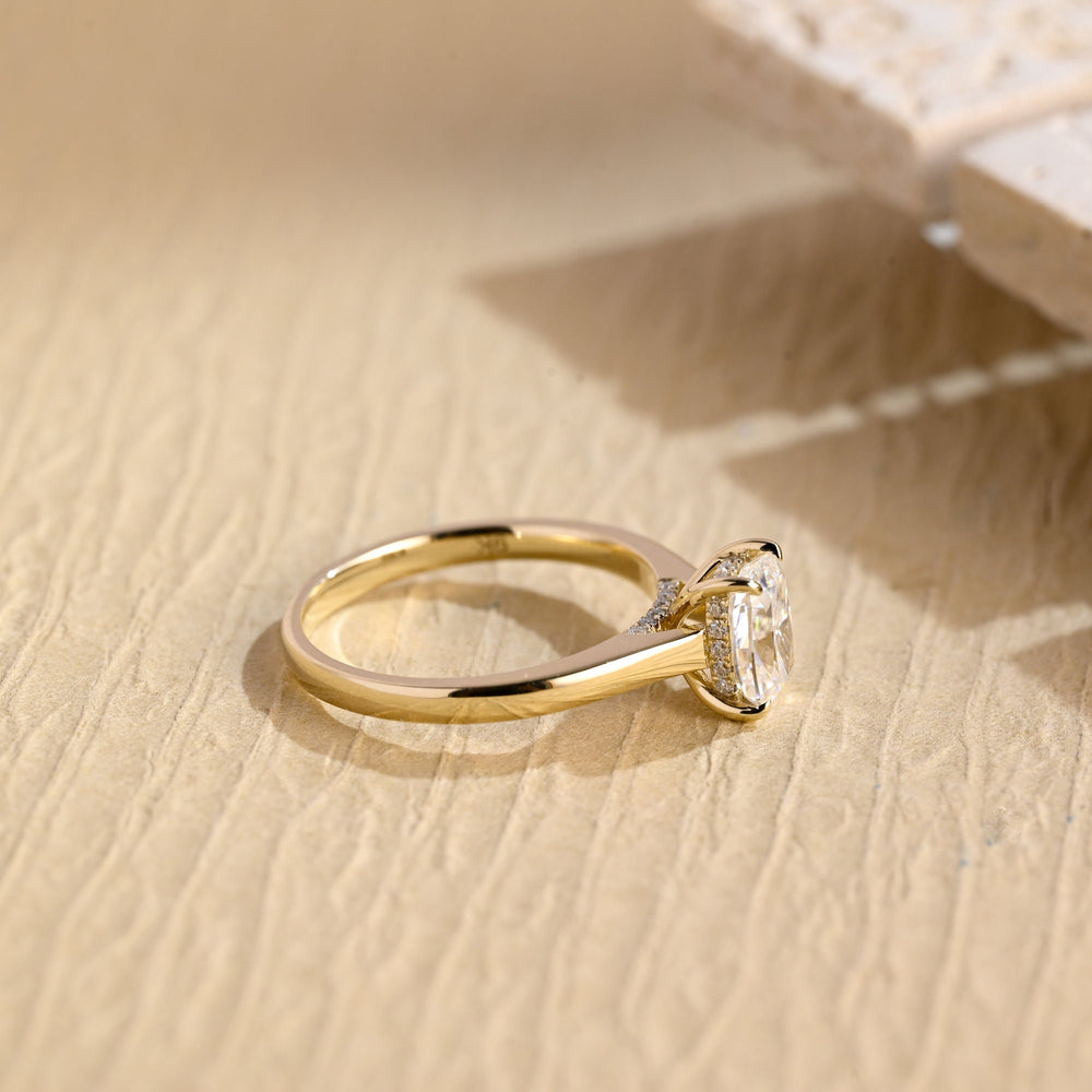 Cushion hidden halo engagement ring viewed from the side