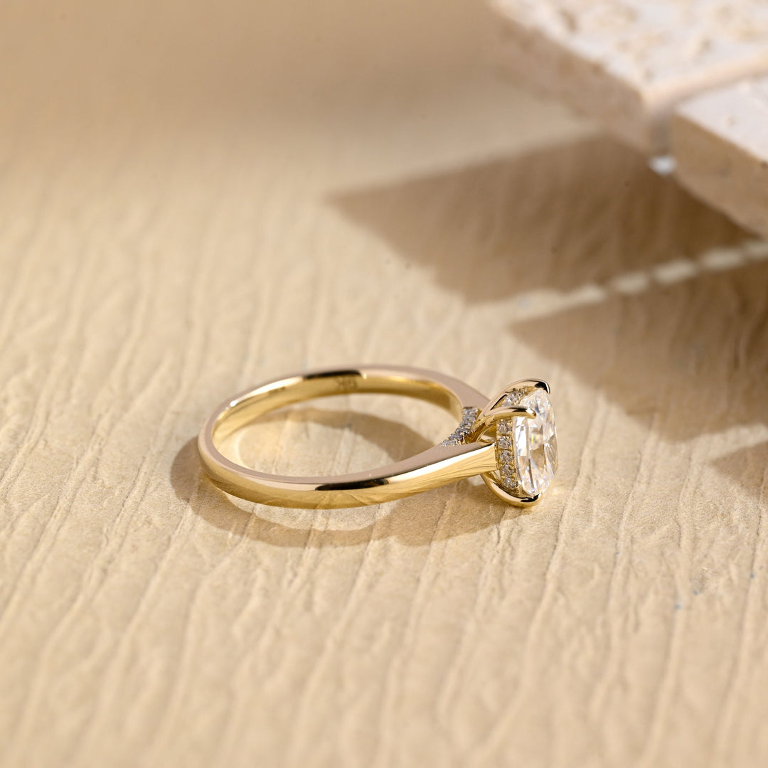 Cushion hidden halo engagement ring viewed from the side