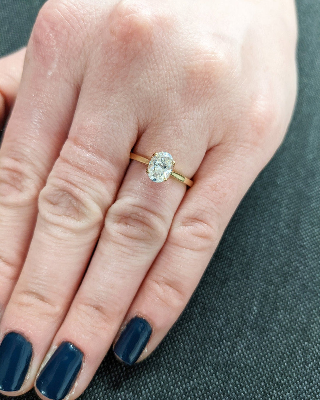modern bridal ring with oval solitaire diamond