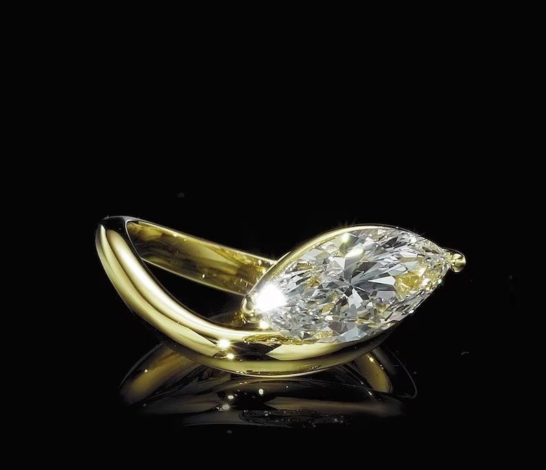 elegant bridal ring, designer marquise ring, marquise statement ring, sophisticated bridal ring, contemporary luxury ring, unique proposal ring, luxury love ring, curved bridal ring, artistic engagement ring.