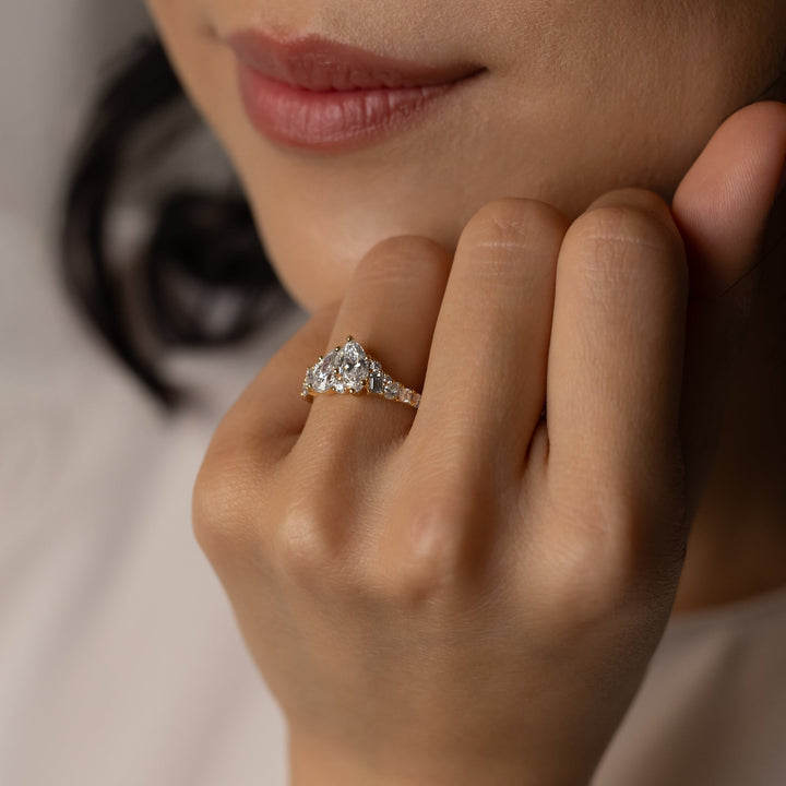 designer marquise ring, pear statement ring, sophisticated bridal ring, contemporary luxury ring, unique proposal ring, luxury love ring, celebrity inspired ring, romantic bridal ring, designer cluster ring.