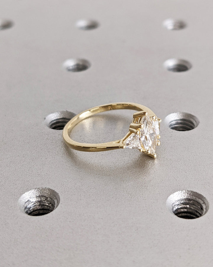 marquise cut center stone engagement ring,