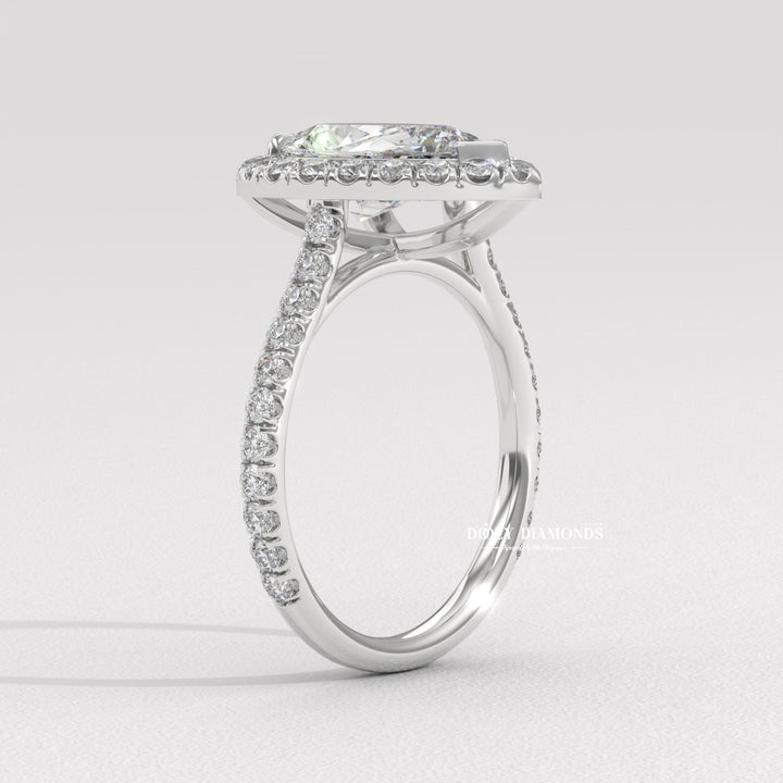 bridal diamond ring, pear center diamond ring, engagement ring with halo, pear solitaire engagement ring, luxury diamond jewelry, eco friendly engagement ring, modern halo engagement ring,