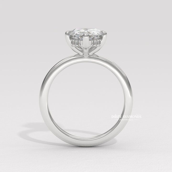 Unique pear shaped engagement ring
Platinum pear shaped solitaire ring
18k gold pear cut diamond ring
Timeless pear shaped engagement ring
Sparkling hidden halo diamond ring