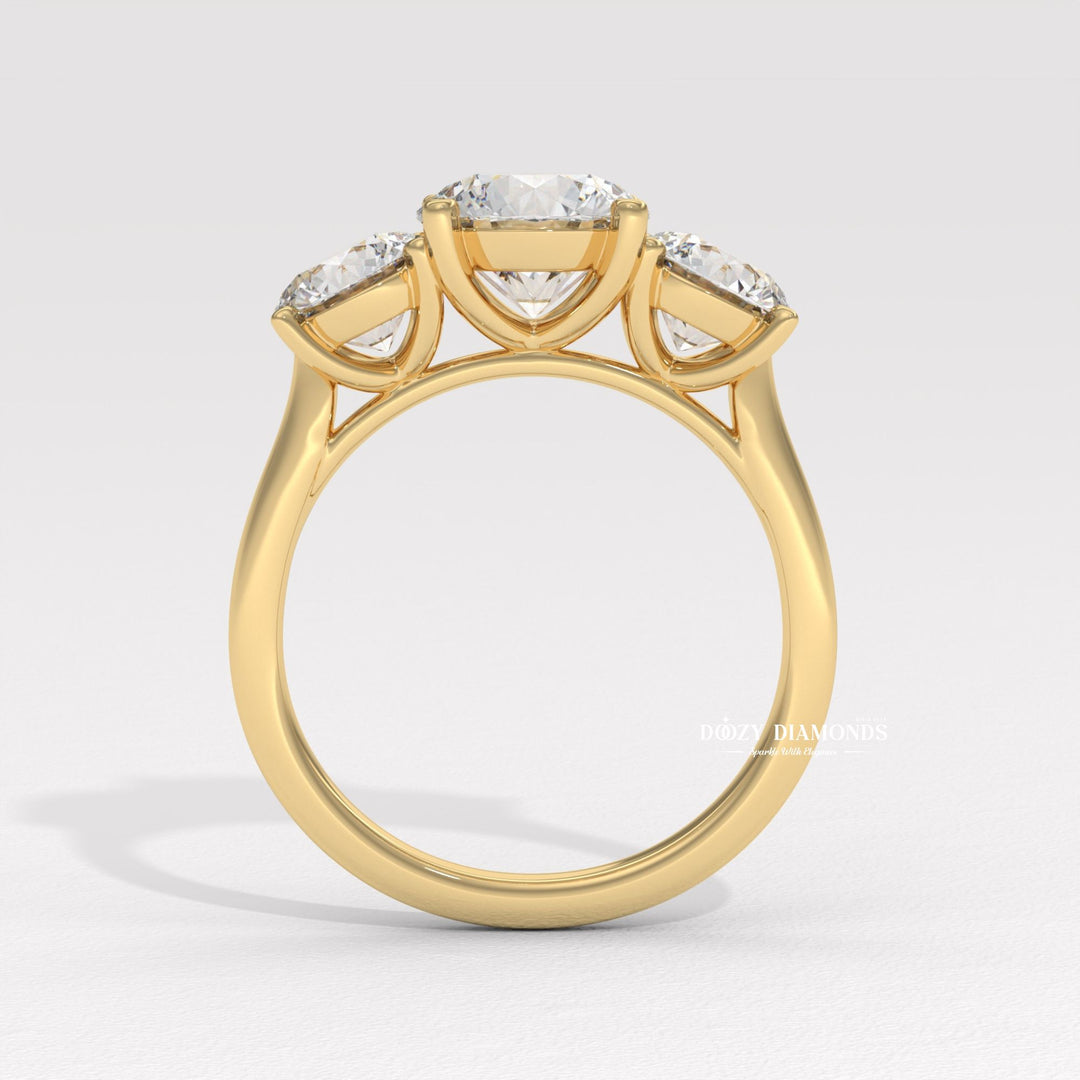 Round brilliant cut accent ring
Triple round diamond ring
Past Present Future ring
Round diamond side stone setting