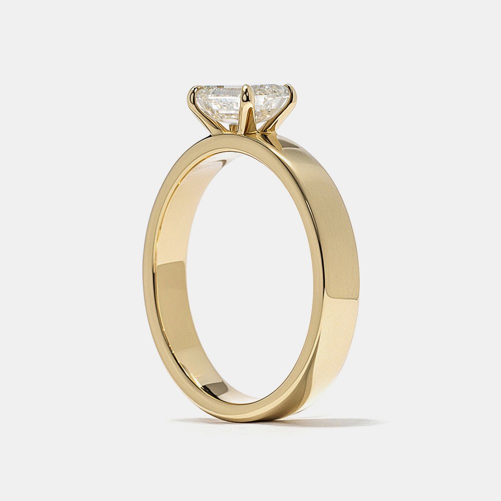 elegant bridal ring, designer emerald ring, emerald statement ring, sophisticated bridal ring, contemporary luxury ring, unique proposal ring, luxury love ring.