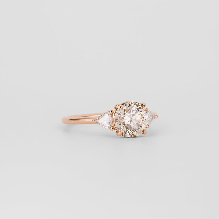 elegant bridal ring, designer trilogy ring, champagne statement ring, sophisticated bridal ring, contemporary luxury ring, unique proposal ring, luxury love ring, colored diamond trilogy ring.