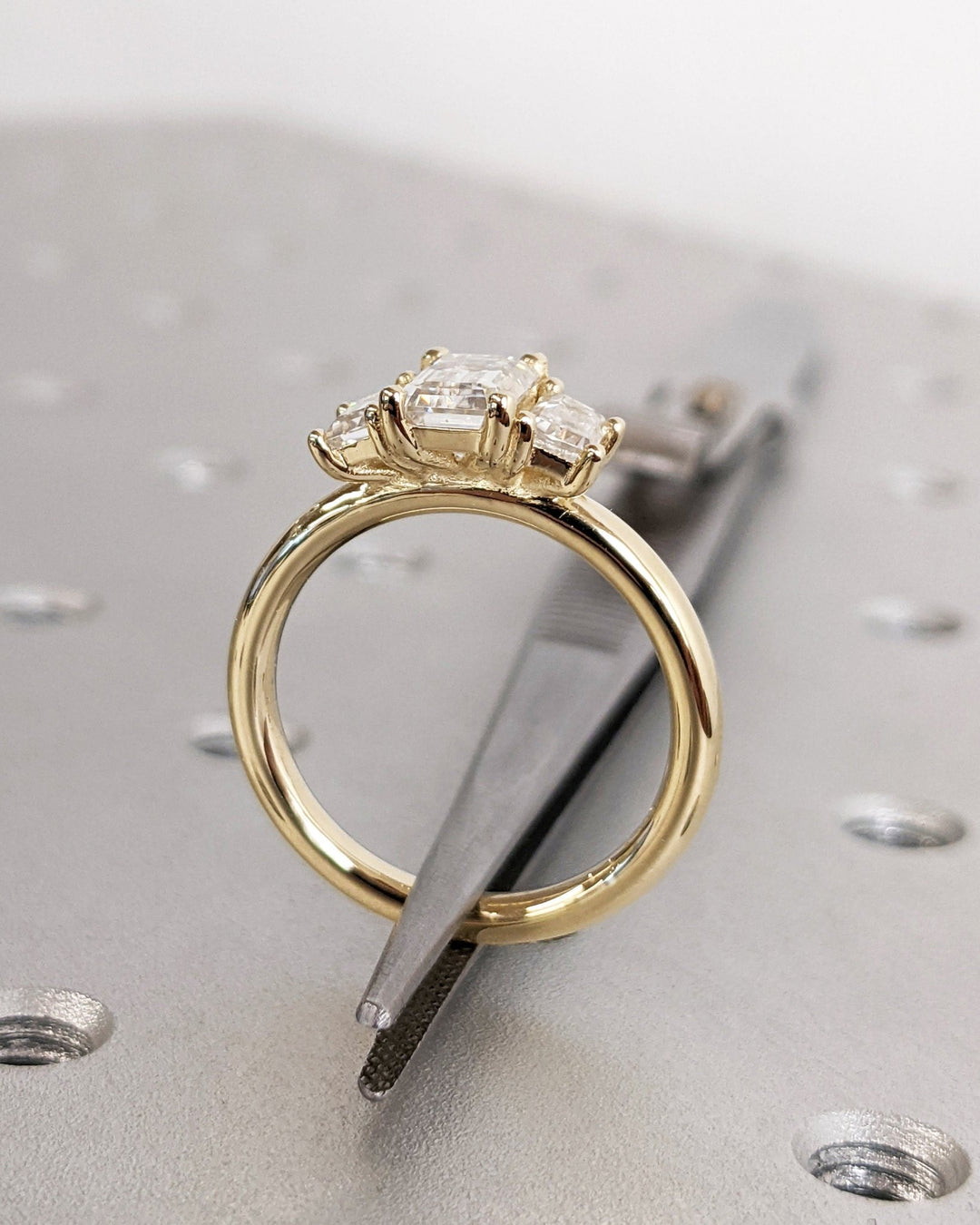 classic emerald cut trilogy ring,