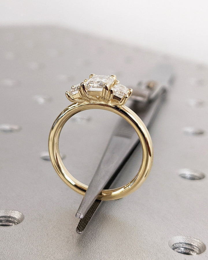 classic emerald cut trilogy ring,