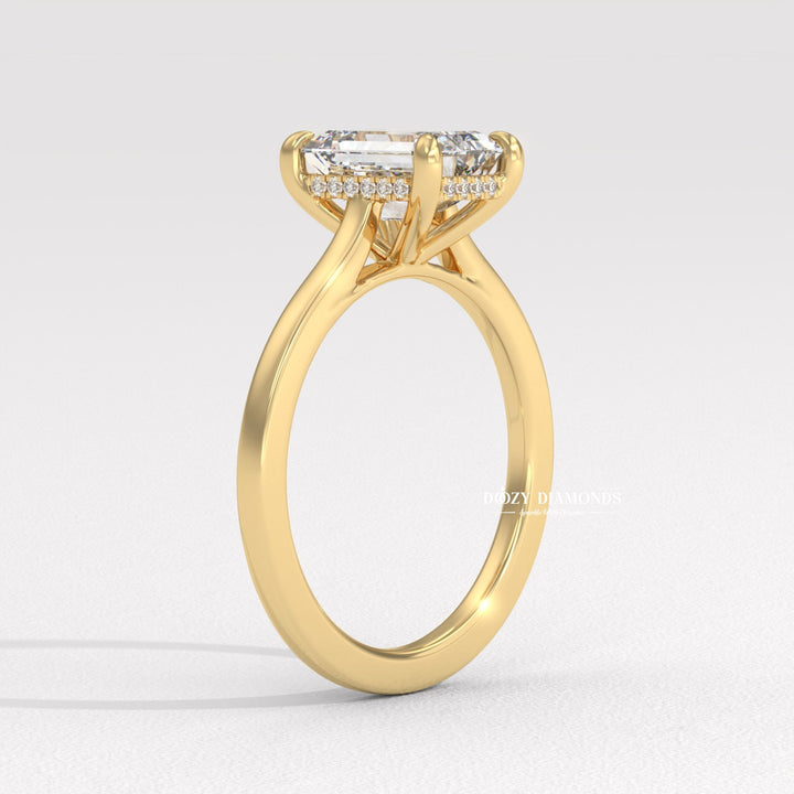 emerald proposal ring, luxury emerald ring, hall of mirrors diamond ring, elongated diamond engagement ring, modern hidden halo ring, bridal diamond jewelry, wedding proposal ring