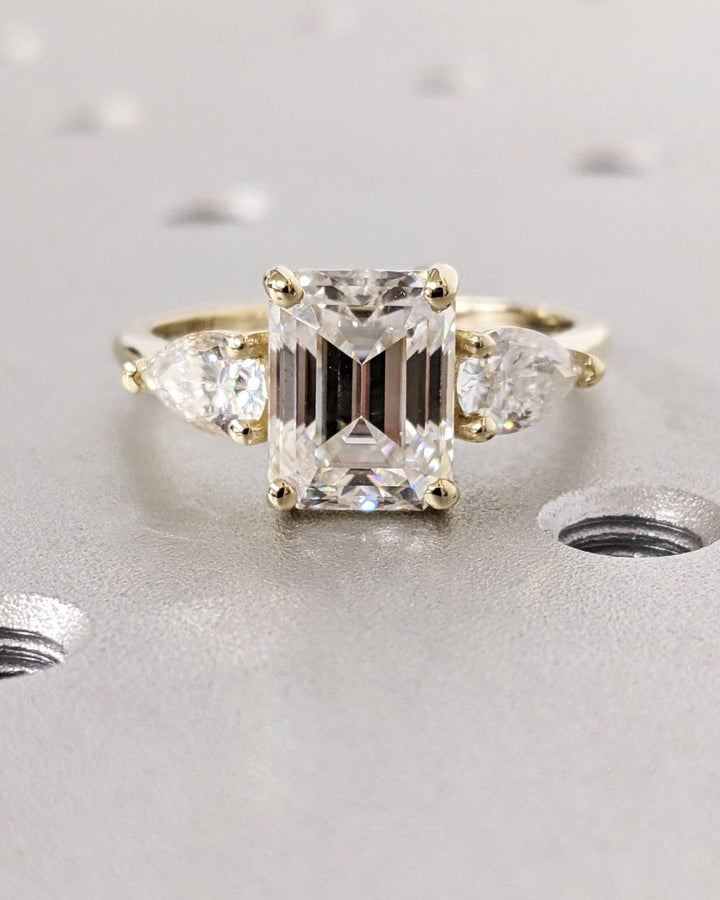 emerald cut side stone ring,