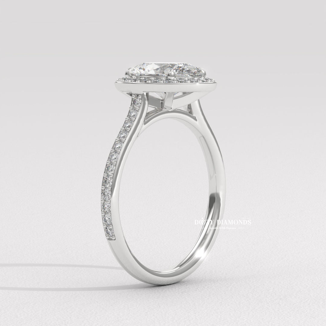 classic halo engagement ring, oval lab diamond ring, oval diamond bridal ring, channel halo ring, luxury halo diamond ring, diamond proposal ring, sustainable bridal ring, ethical lab diamond ring, oval cut lab diamond ring, halo wedding ring, fine jewelry engagement ring, dazzling halo ring,