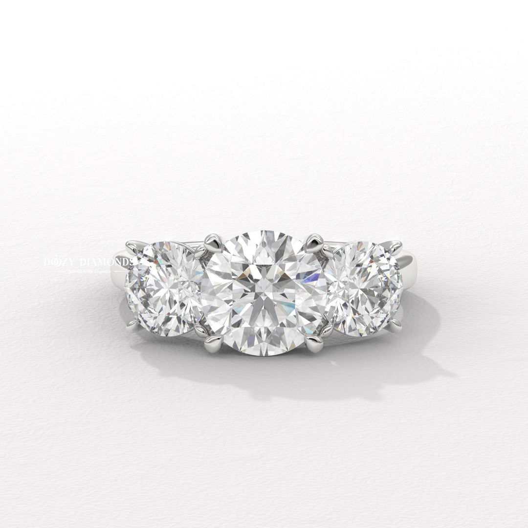 White gold side stone ring
Platinum round diamond engagement ring
Minimalist round three stone ring