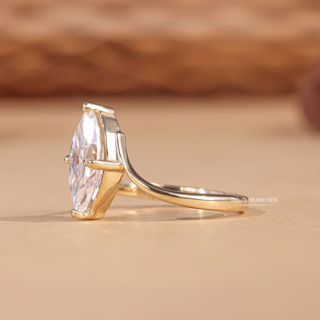 fine jewelry engagement ring, elegant diamond ring women, timeless diamond ring, women diamond jewelry, luxury bridal jewelry, sophisticated engagement ring, statement engagement ring, elongated diamond ring