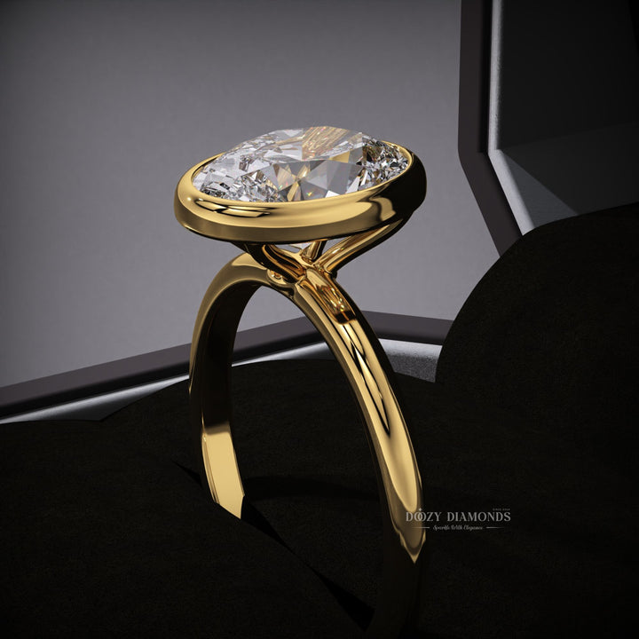 engagement ring
lab grown diamond engagement ring
bezel set diamond ring
oval bezel ring
sustainable engagement ring
eco friendly diamond ring
ethical diamond ring
lab created diamond ring
oval cut lab diamond