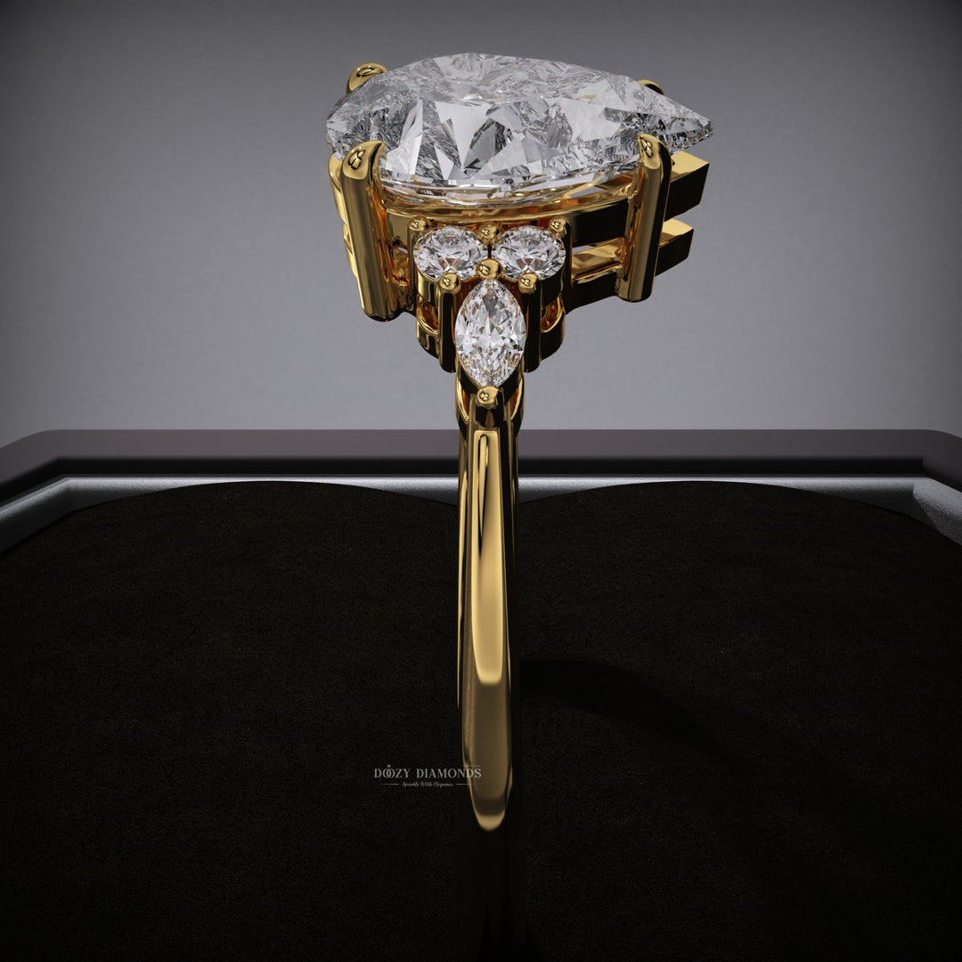 romantic engagement ring
timeless engagement ring
pear solitaire ring
sleek diamond ring
trendy cluster ring