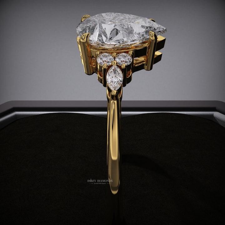 romantic engagement ring
timeless engagement ring
pear solitaire ring
sleek diamond ring
trendy cluster ring