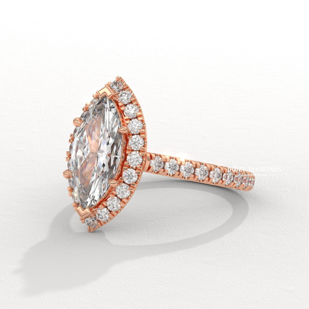 fine jewelry engagement ring, dazzling diamond ring, solitaire engagement ring, elegant diamond ring, bridal diamond jewelry, marquise center diamond ring, elongated diamond ring, luxury diamond jewelry,