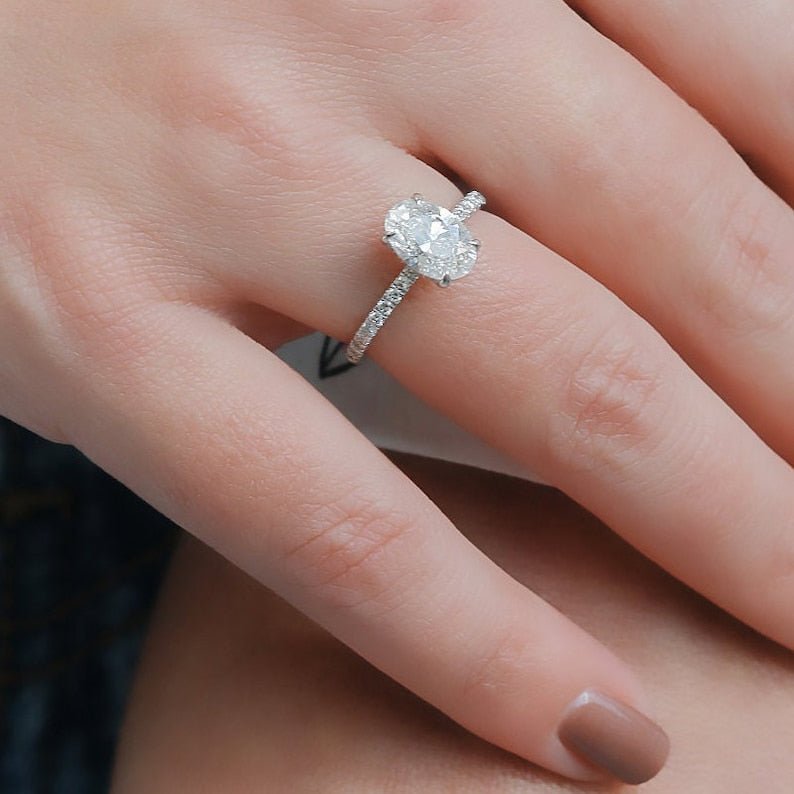 Oval cut diamond ring worn on hand