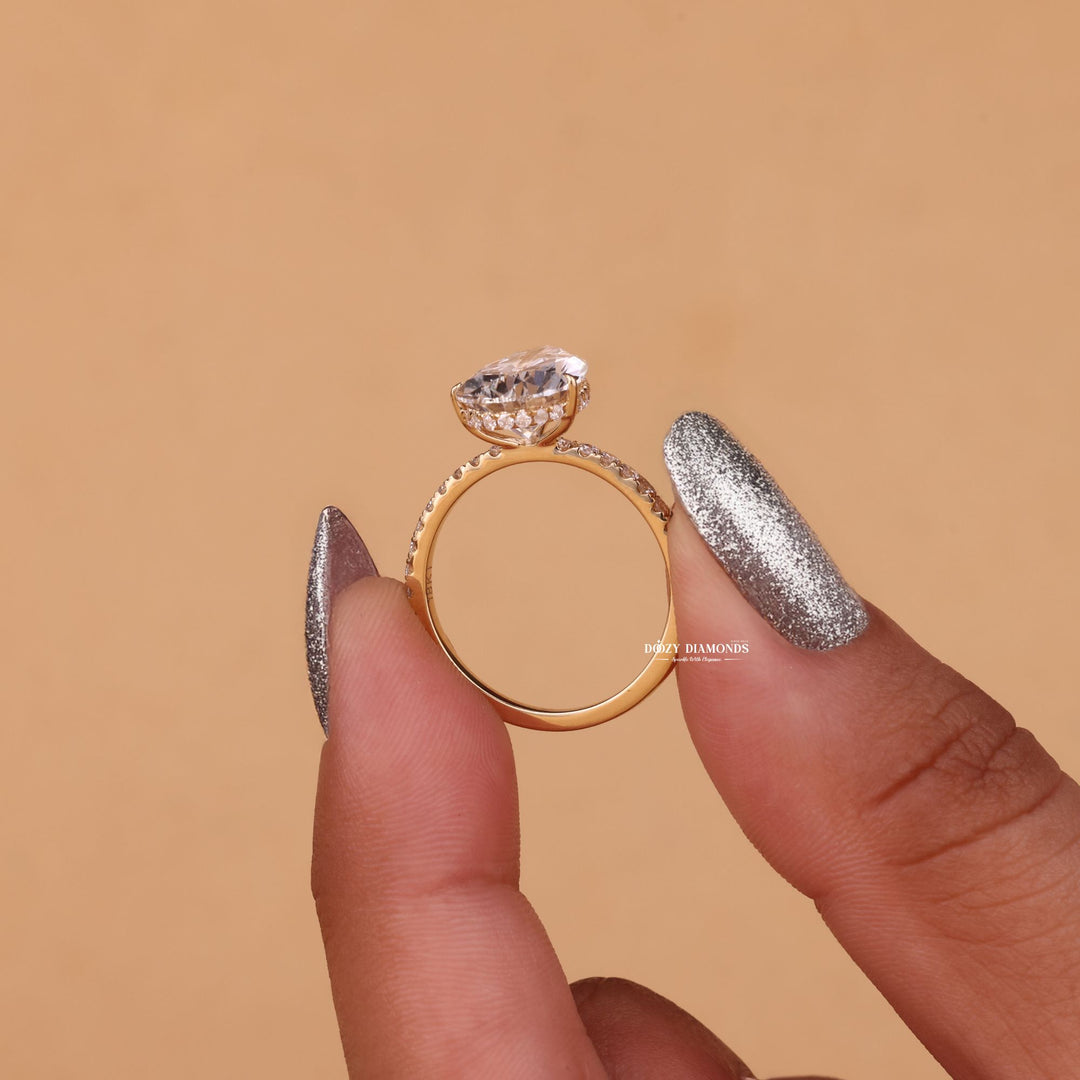 bridal jewelry masterpiece, sophisticated luxury engagement ring, pear diamond jewelry collection, designer hidden halo ring, luxury proposal masterpiece, high brilliance bridal jewelry,
