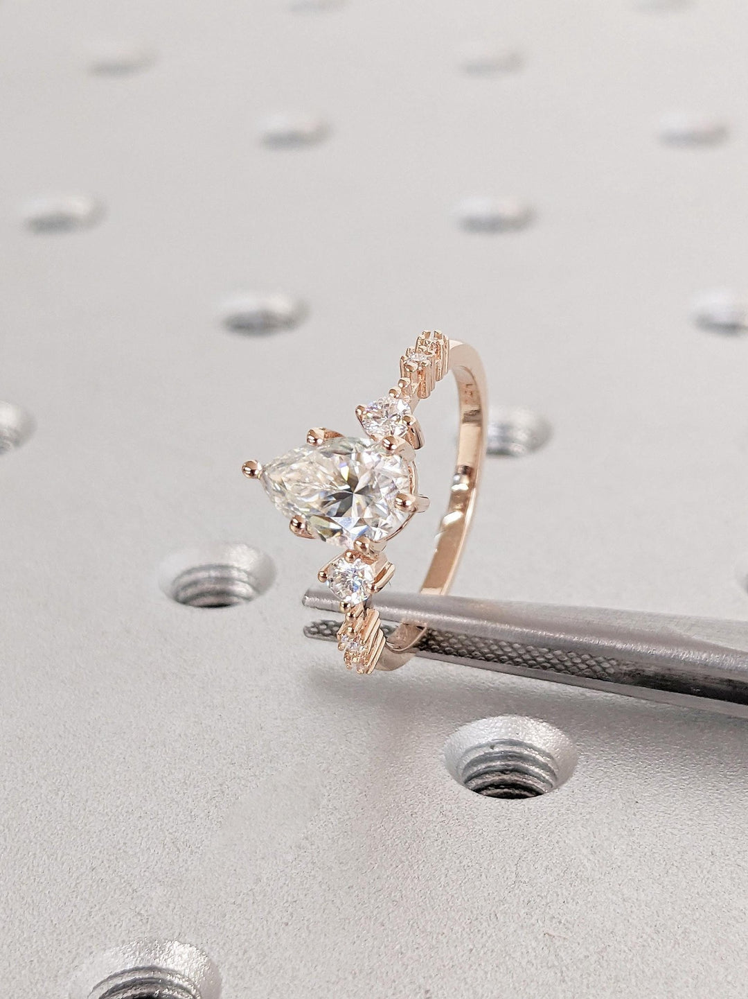 exclusive diamond ring, fine luxury jewelry, sustainable bridal jewelry, handcrafted proposal ring, luxury engagement jewelry, modern luxury ring, elegant bridal ring, designer pear ring,