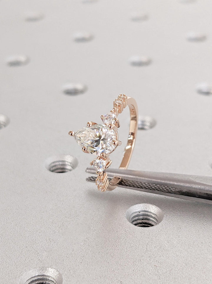 exclusive diamond ring, fine luxury jewelry, sustainable bridal jewelry, handcrafted proposal ring, luxury engagement jewelry, modern luxury ring, elegant bridal ring, designer pear ring,