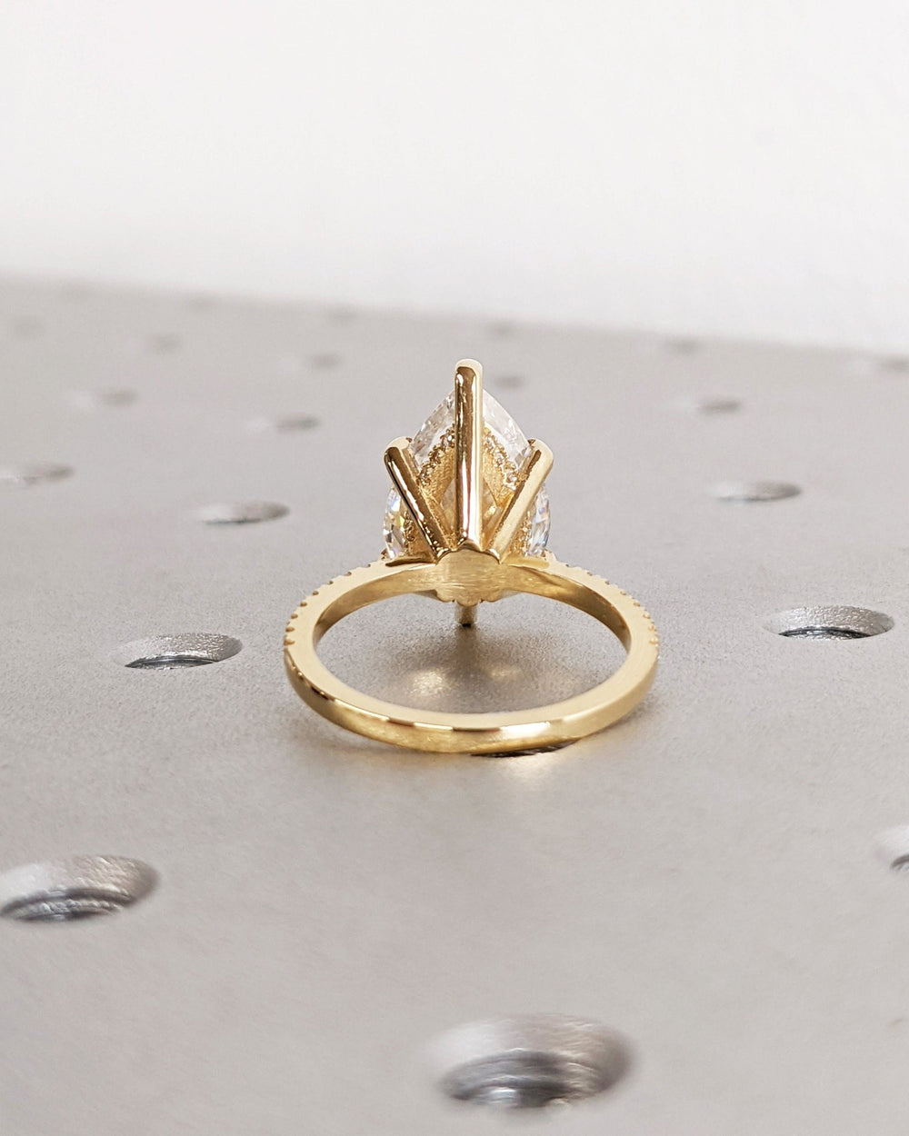 pear cut engagement ring with accent diamonds,