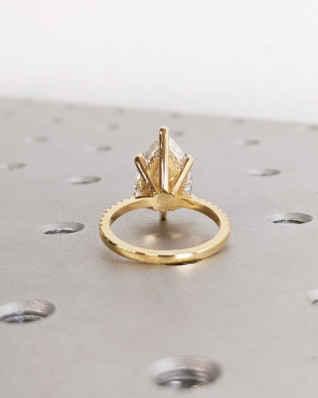 pear cut engagement ring with accent diamonds,